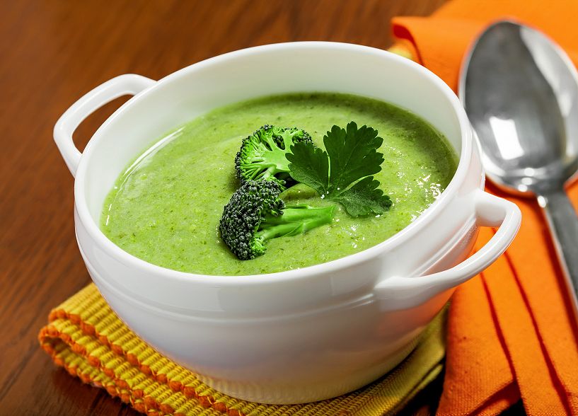 Broccoli cream soup on a tablecloth
